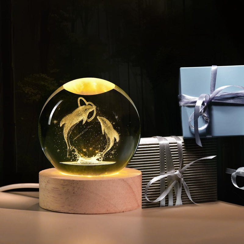 3D crystal ball night lamp lit warm white on a solid wooden base
