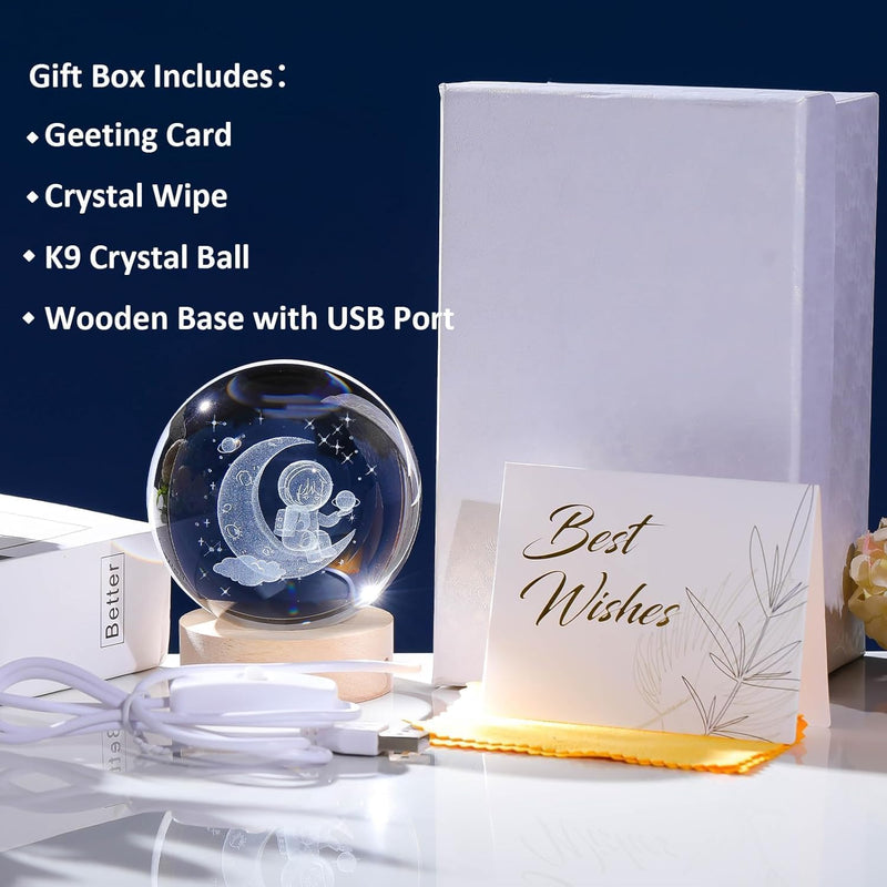 Astronaut crystal ball night lamp showing an astronaut seated on a crescent moon laser-engraved inside the crystal
