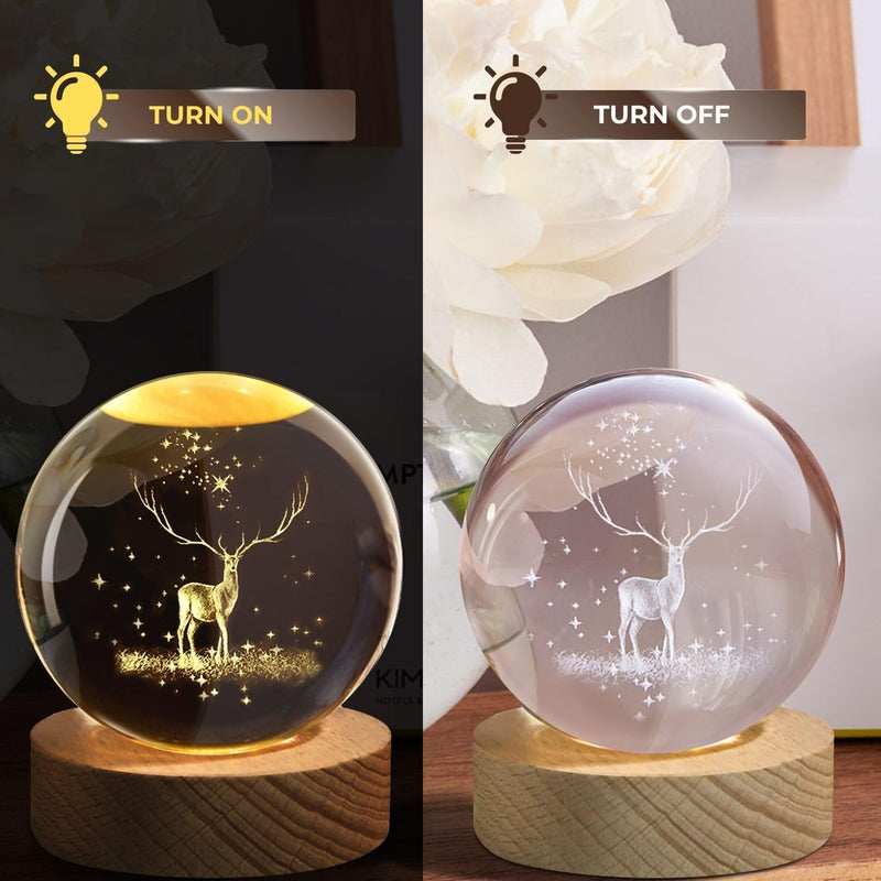 Deer crystal ball night lamp showing a stag among forest trees laser-engraved inside the crystal