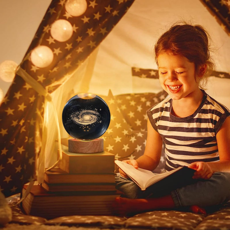 Galaxy crystal ball night lamp showing a spiral galaxy with a bright core laser-engraved inside the crystal
