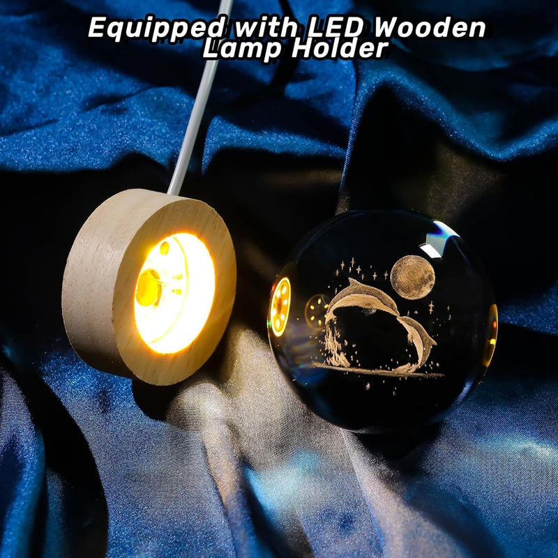 Dolphin crystal ball night lamp showing two dolphins leaping beneath a full moon laser-engraved inside the crystal