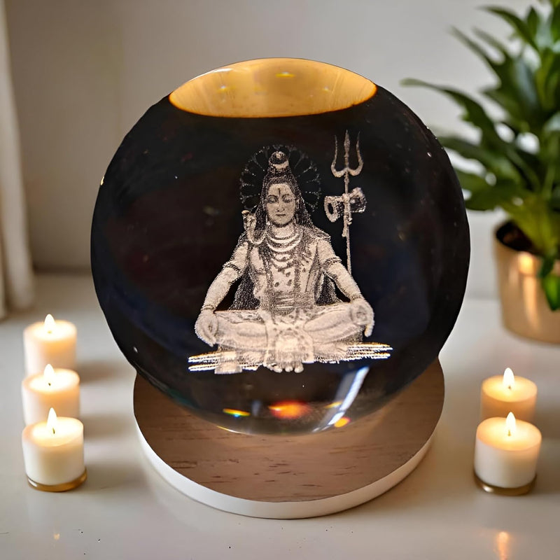 Lord Shiva crystal ball night lamp lit warm white on its wooden base