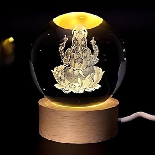 Ganesh Ji crystal ball night lamp lit warm white on its wooden base