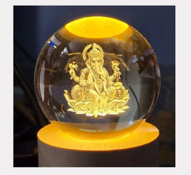 Ganesh Ji crystal ball night lamp showing Ganesh Ji seated laser-engraved inside the crystal